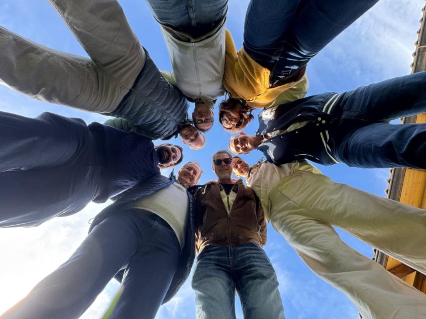 Participants standing in a circle during a facilitated session